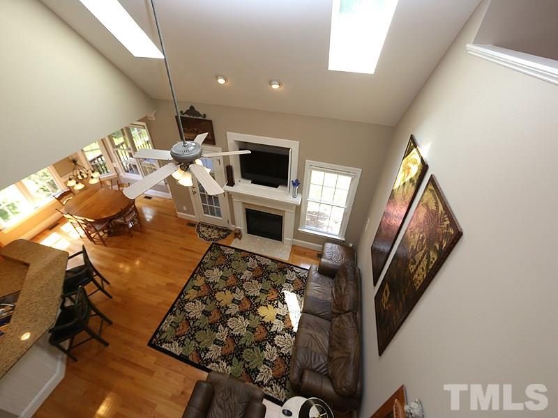 204 Okamato Street Raleigh, NC 27603 - Photo 11 of 25 a living room with furniture and a flat screen tv