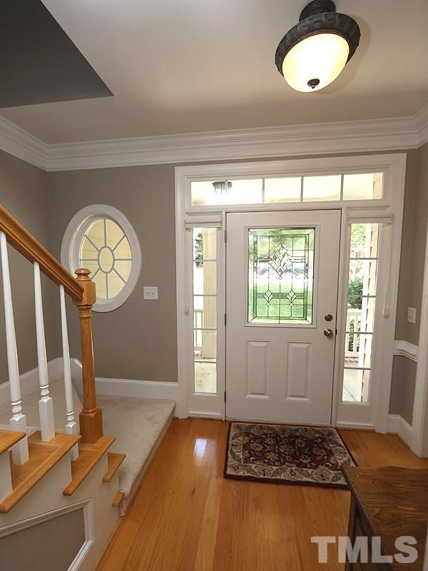 204 Okamato Street Raleigh, NC 27603 - Photo 3 of 25 a view of an entryway with wooden floor