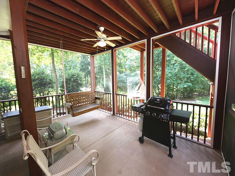 204 Okamato Street Raleigh, NC 27603 - Photo 21 of 25 a living room with furniture and a floor to ceiling window