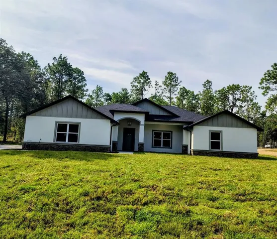 a house with trees in the background