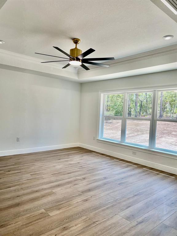 13322 Southwest 66th Street Ocala, FL 34481 - Photo 11 of 15 a view of an empty room with wooden floor and a window