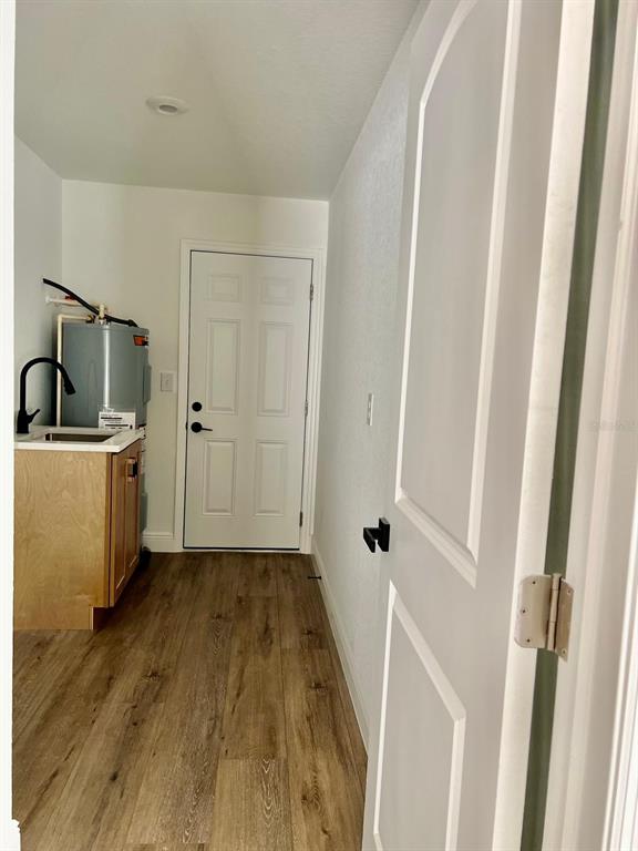 13322 Southwest 66th Street Ocala, FL 34481 - Photo 14 of 15 a view of a kitchen with a sink and wooden floor
