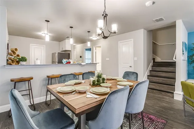 a view of a dining room and livingroom with furniture