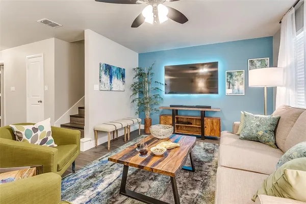 a living room with furniture and a flat screen tv