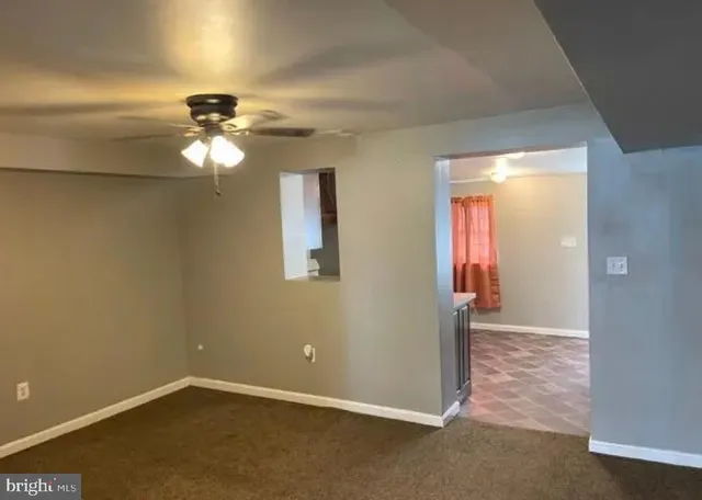a view of a chandelier fan in a room