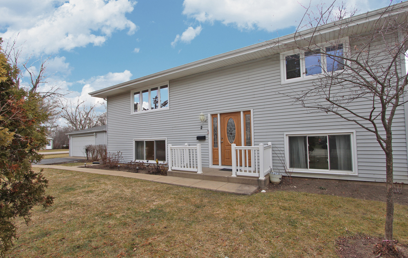 2 Butterfield Road Lake Zurich, IL 60047 - Photo 1 of 2 a view of a house with a yard and garage