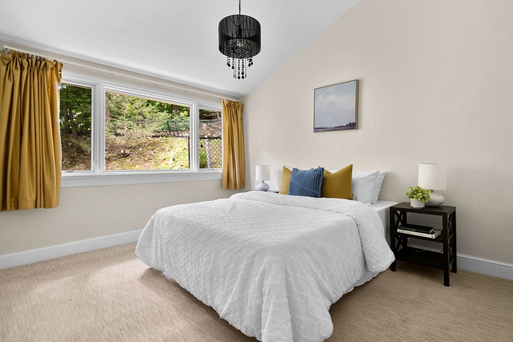 90 Ridge Street Arlington, MA 02474 - Photo 19 of 35 a bedroom with a bed lamps and window