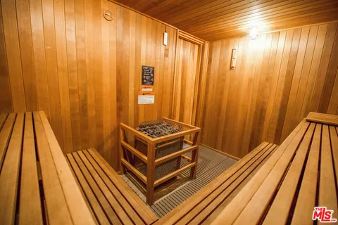 a view of a backyard with large trees