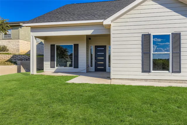 a view of front door and yard