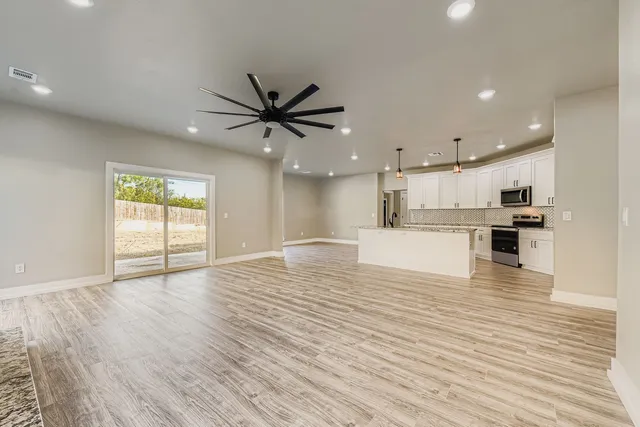 a view of kitchen with cabinets and wooden floor