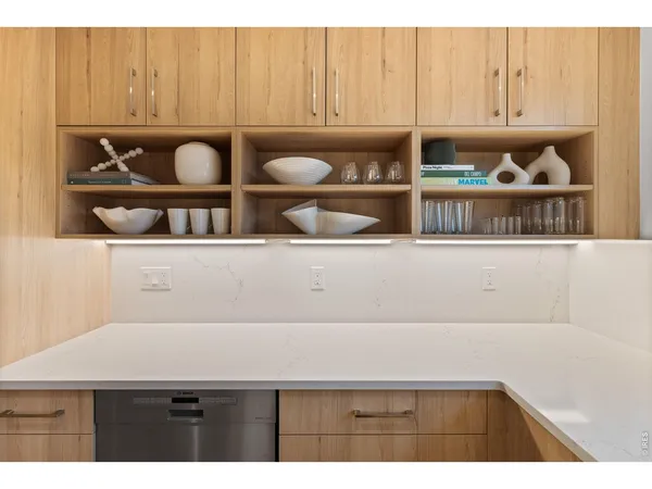 a kitchen with stainless steel appliances a refrigerator and a stove