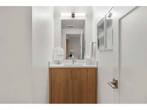 a bedroom with a large bed and a large window