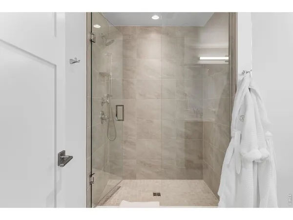 a view of a floor to ceiling window and wooden floor