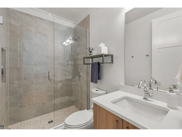 a outdoor living room with furniture and a potted plant