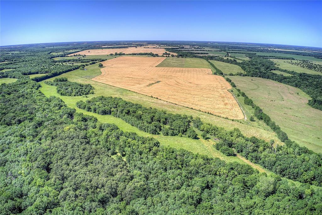 6399 Fm 2068 Commerce, TX 75428 - Photo 19 of 40 a view of a swimming pool and an outdoor seating