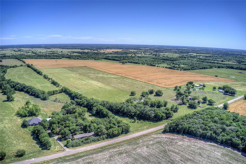 6399 Fm 2068 Commerce, TX 75428 - Photo 34 of 40 an aerial view of residential building and lake