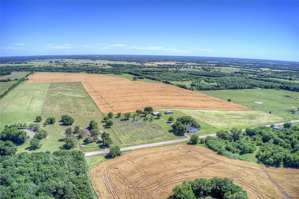 6399 Fm 2068 Commerce, TX 75428 - Photo 36 of 40 an aerial view of a houses with ocean view