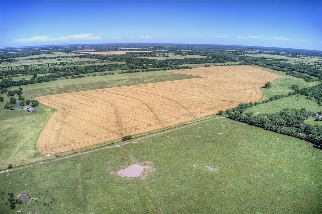 6399 Fm 2068 Commerce, TX 75428 - Photo 6 of 40 a view of a lake from a yard