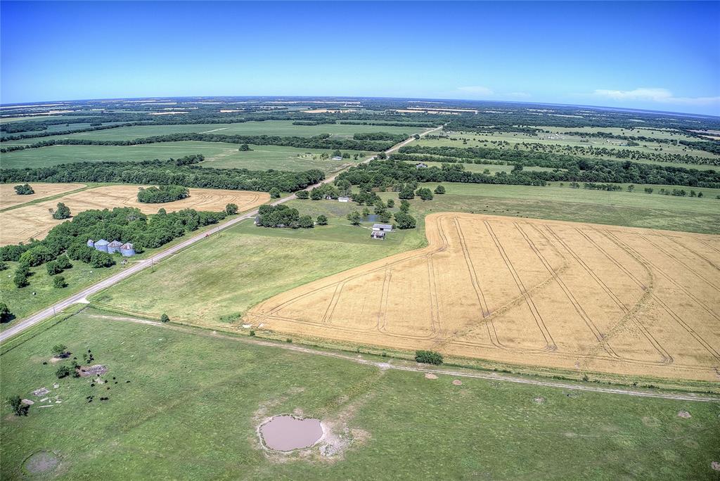 6399 Fm 2068 Commerce, TX 75428 - Photo 7 of 40 a view of a lake with a yard