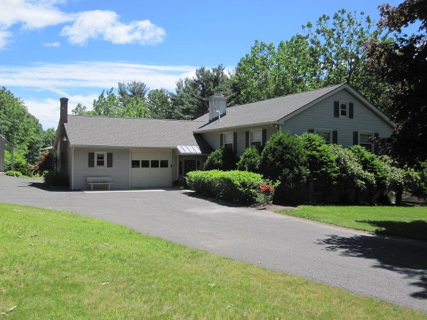 294 Southampton Road Westhampton, MA 01027 - Photo 1 of 26 a front view of a house with a yard and garage