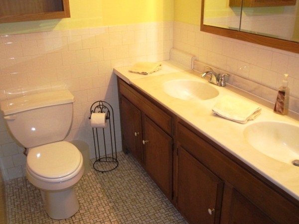 294 Southampton Road Westhampton, MA 01027 - Photo 14 of 26 a bathroom with a granite countertop toilet sink and mirror