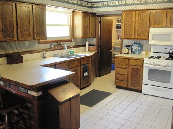 294 Southampton Road Westhampton, MA 01027 - Photo 15 of 26 a kitchen with a sink appliances and cabinets