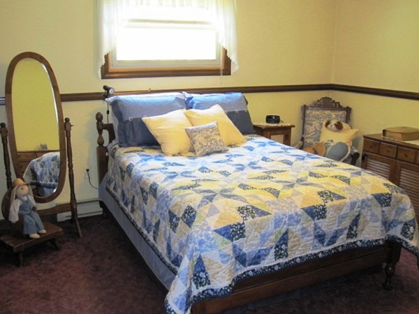 294 Southampton Road Westhampton, MA 01027 - Photo 19 of 26 a bed sitting in a bedroom next to a window