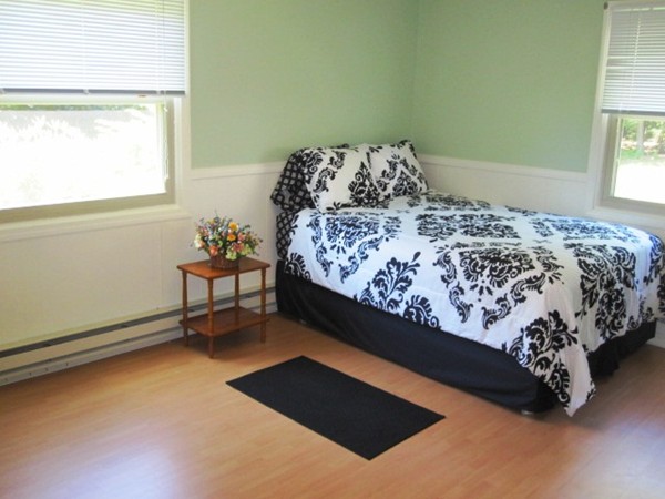294 Southampton Road Westhampton, MA 01027 - Photo 10 of 26 a bed sitting in a bedroom next to a window