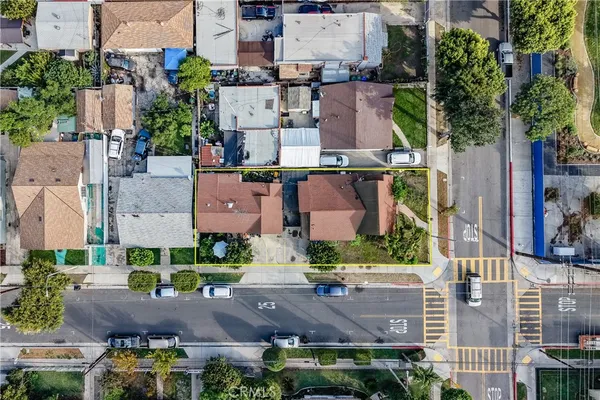 an aerial view of residential houses with outdoor space
