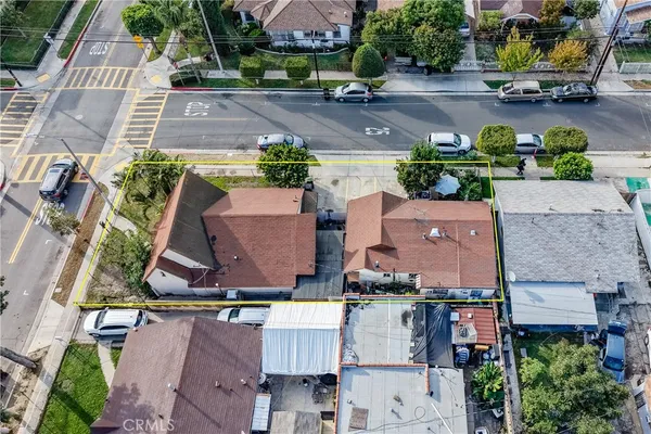 an aerial view of residential houses with outdoor space