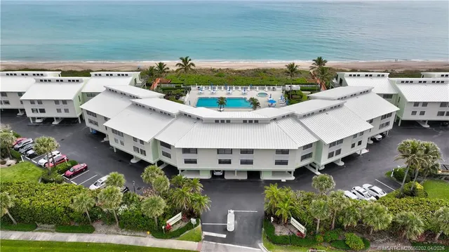 an aerial view of a house with outdoor space