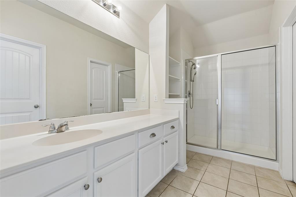 2850 Dusty Road Forney, TX 75126 - Photo 8 of 11 Bathroom featuring an extended vanity with dual sinks, white cabinetry, and brushed nickel hardware