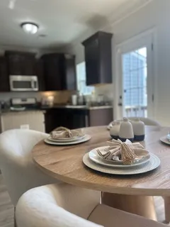 a dining room with furniture and window