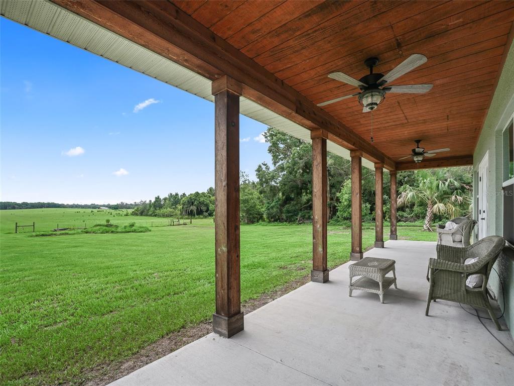8567 Cr 635 Bushnell Bushnell, FL 33513 - Photo 26 of 46 a view of a big room with porch and furniture