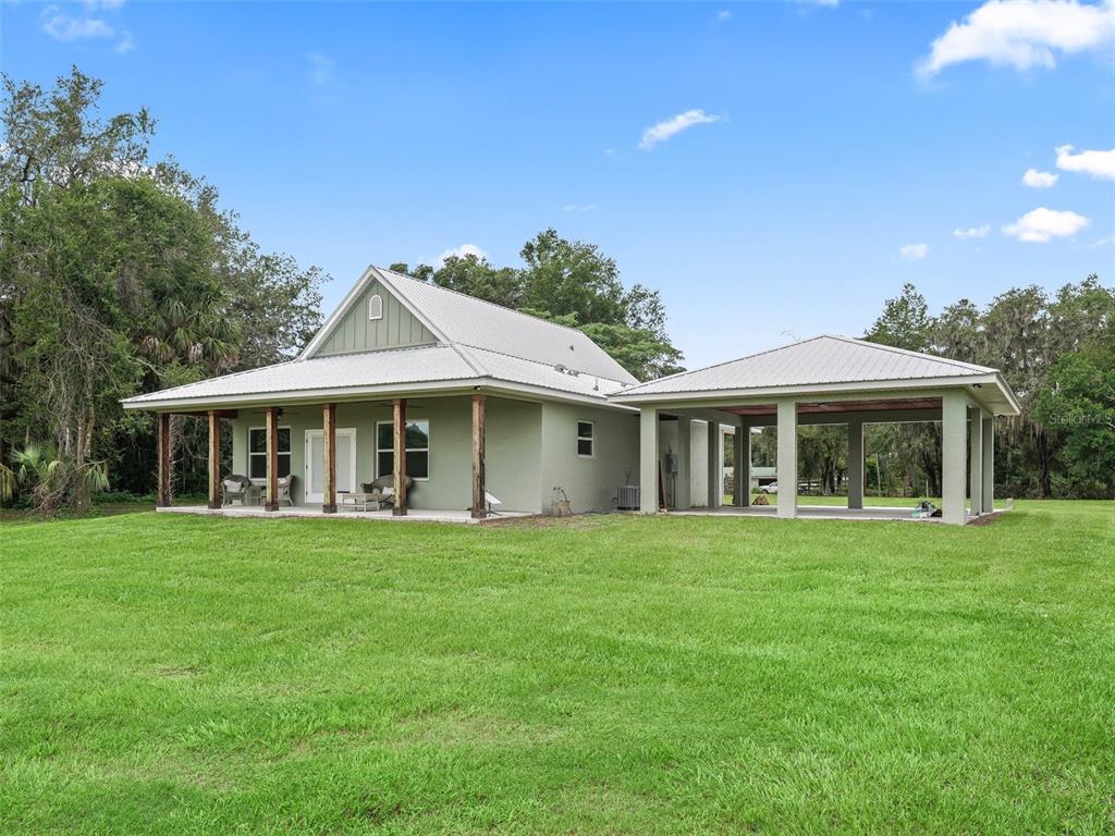8567 Cr 635 Bushnell Bushnell, FL 33513 - Photo 27 of 46 a front view of a house with a garden