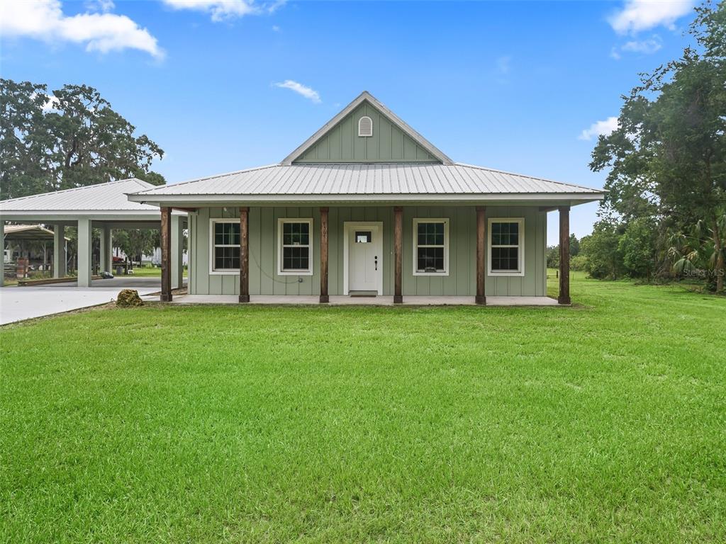 8567 Cr 635 Bushnell Bushnell, FL 33513 - Photo 3 of 46 a front view of a house with a yard
