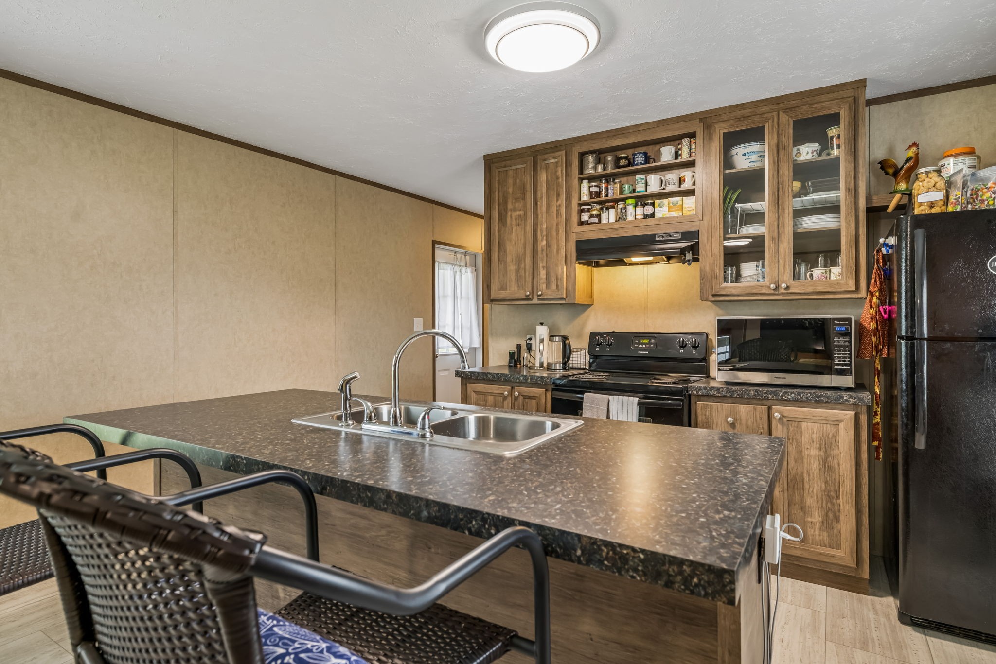 280 Kingdom Road Unionville, TN 37180 - Photo 8 of 65 a kitchen with a table chairs stove and cabinets