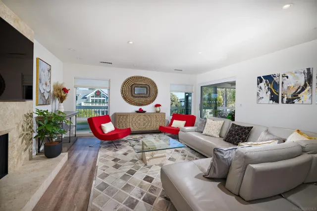 a living room with fireplace furniture and a flat screen tv