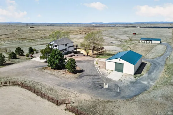 an aerial view of a house with a ocean view