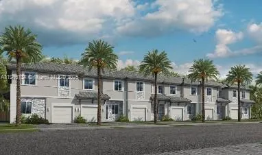 a front view of residential houses with yard