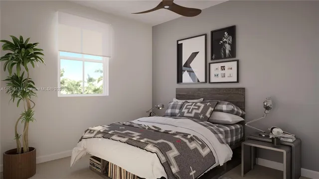 a bedroom with a bed and a potted plant