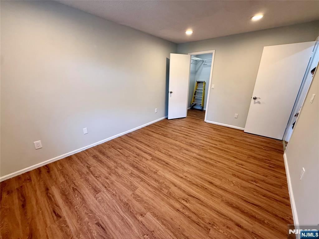 197 Larch Lane Mahwah, NJ 07430 - Photo 9 of 11 a view of an empty room with wooden floor