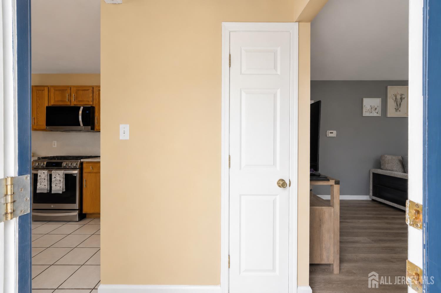 12 Pierrepont Avenue Middlesex, NJ 08846 - Photo 10 of 30 a view of a hallway with wooden floor and dining room
