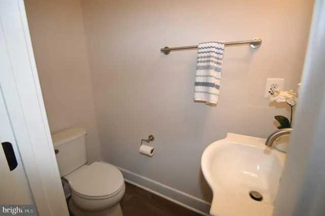 a bathroom with a toilet and a sink