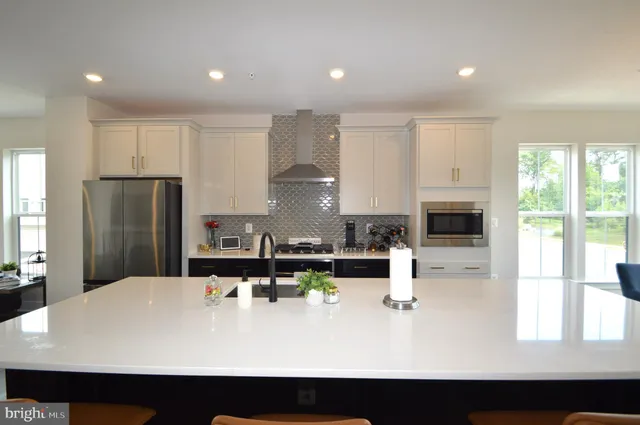 a kitchen with counter top space cabinets and stainless steel appliances