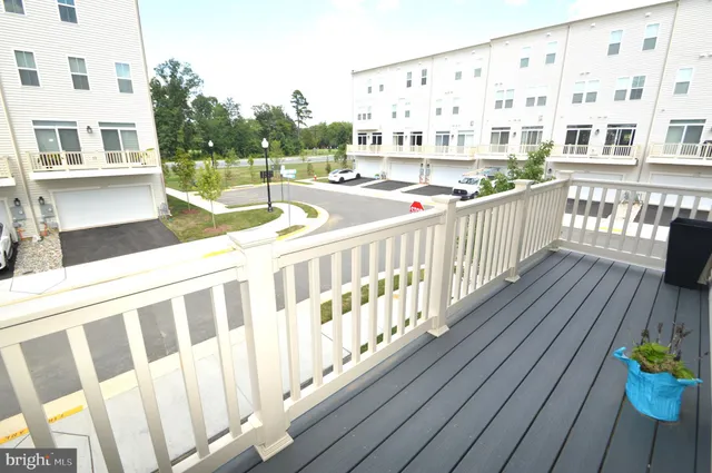 a view of a balcony with wooden floor