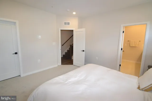 a bedroom with a bed and a table