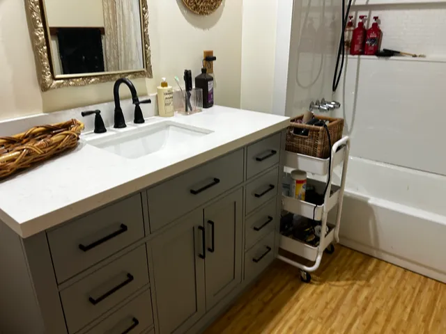 a bedroom with a bed and dresser