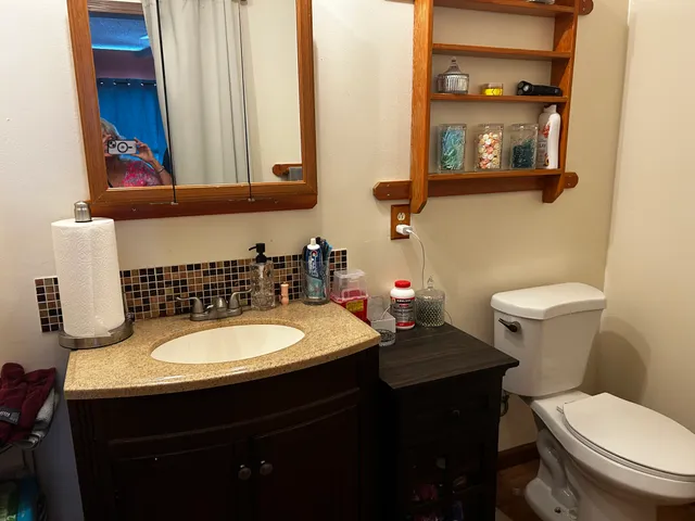 a bedroom with a bed and glass door