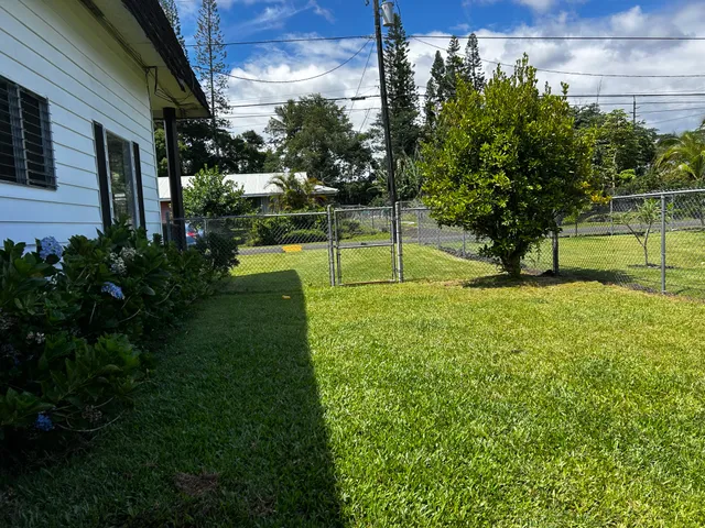 a bedroom with a bed lamps and a large mirror